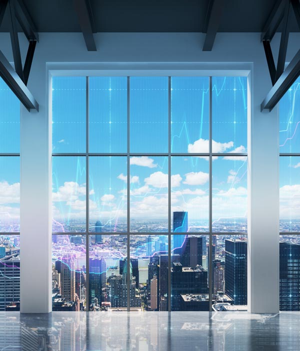High rise view in city with graph data overlaid on windows